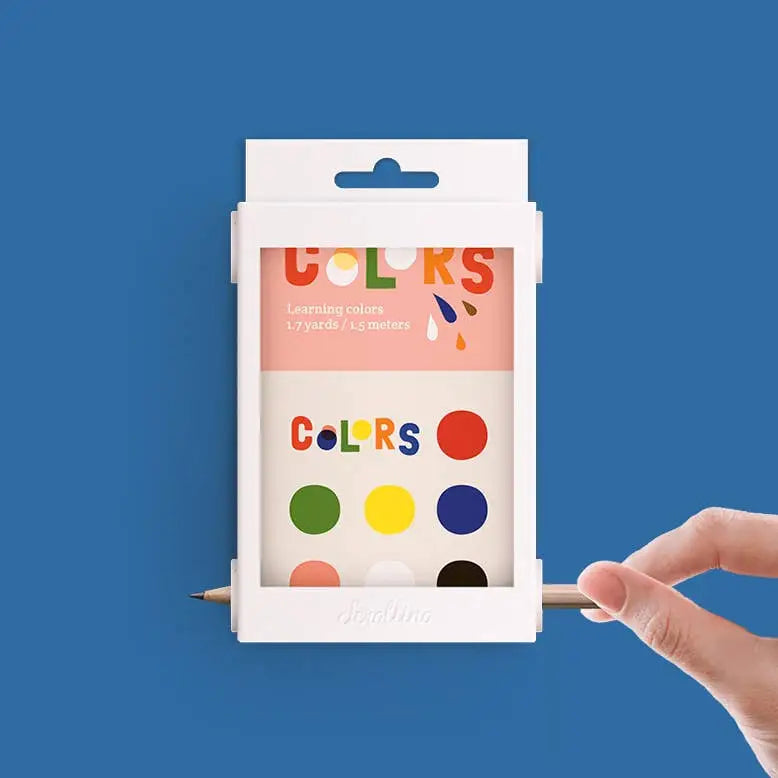 Scrollino Colors Learning Book with colorful illustrated boards and interactive rewinding system for children's motor skills.