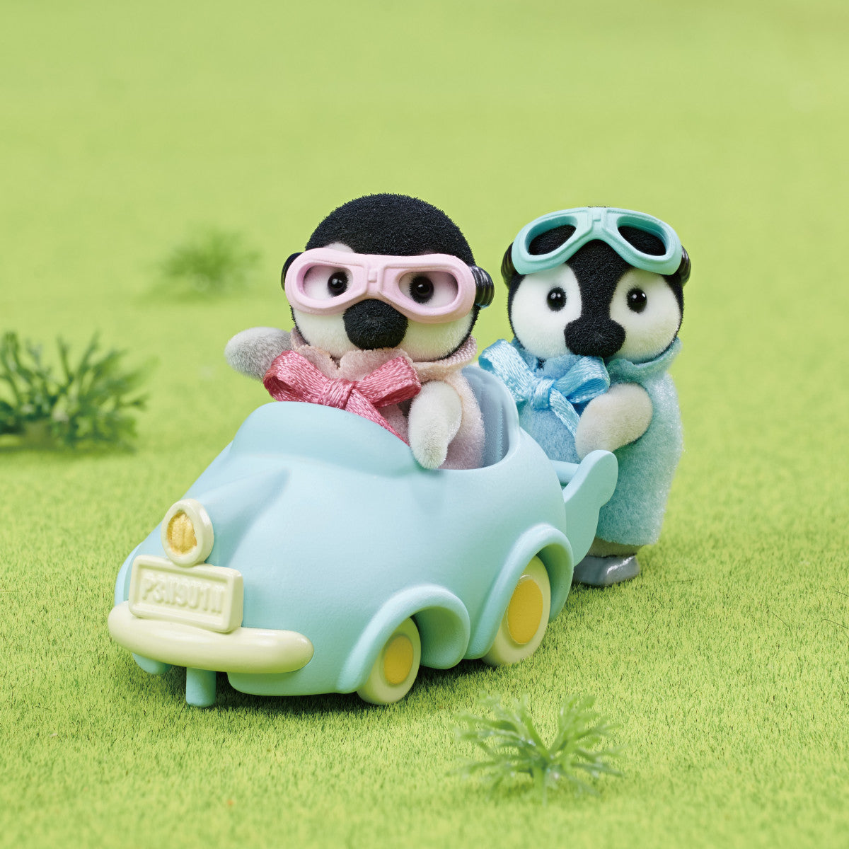 Penguin Babies Ride features twin penguin figures Pearl and Rocky in pink and blue with goggles and blue pushcart vehicle.