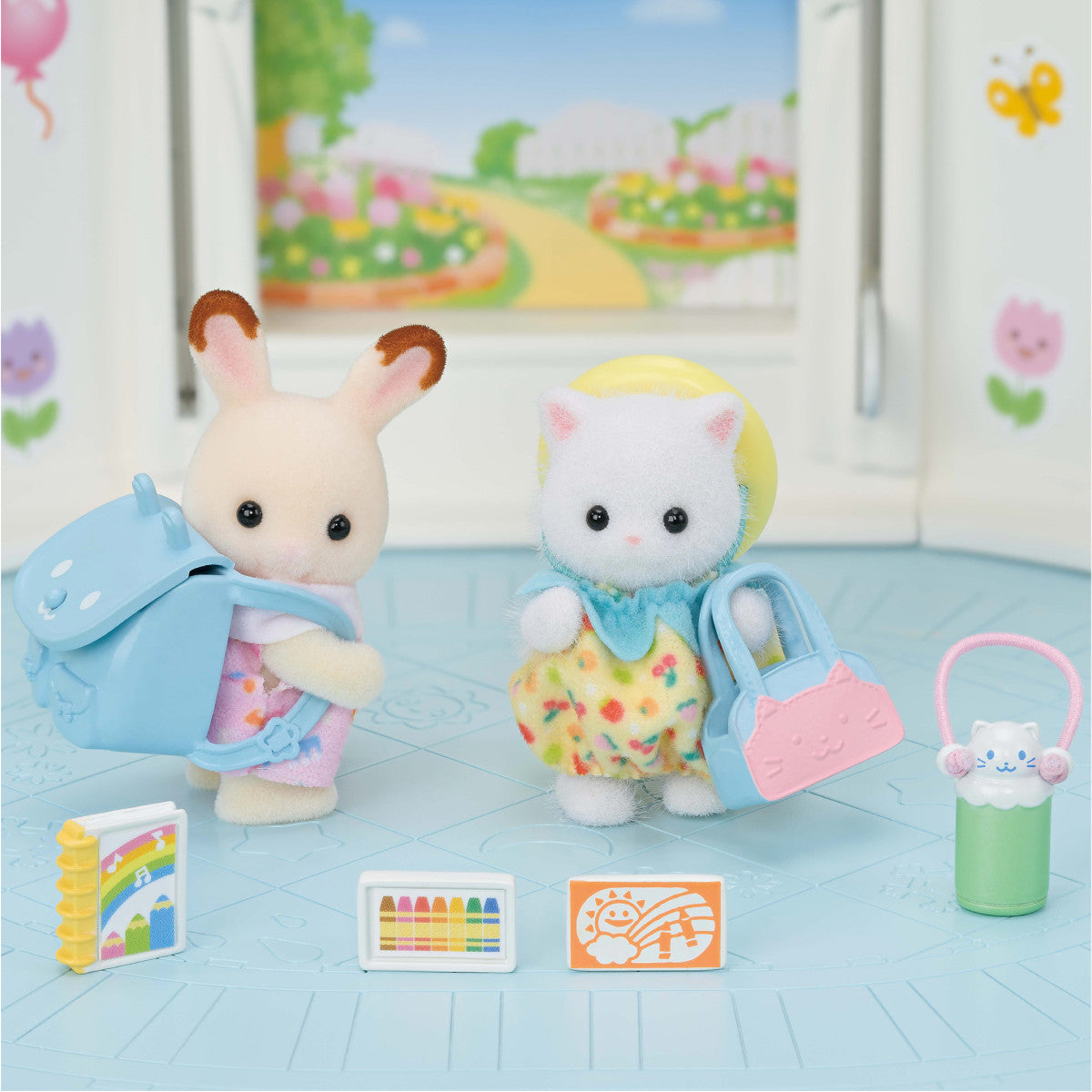 Nursery Friends | Walk Along Duo with two babies in colorful clothes and nursery accessories indoor setting.