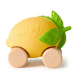 Yellow lemon-shaped baby car toy with wooden wheels and green leaf details for sensory play