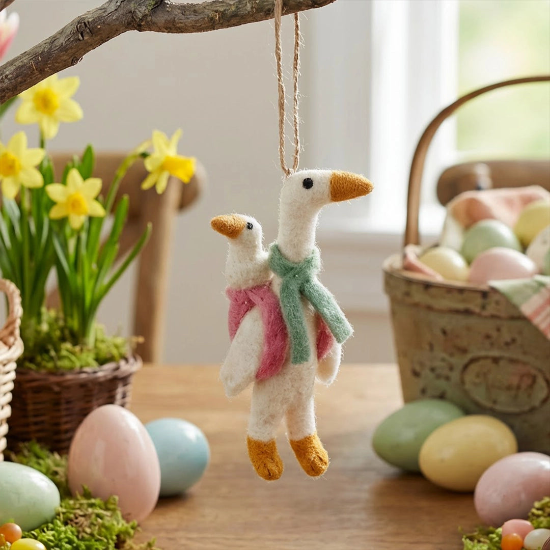 Mother Goose Felt Ornament featuring two felt geese hanging from a branch