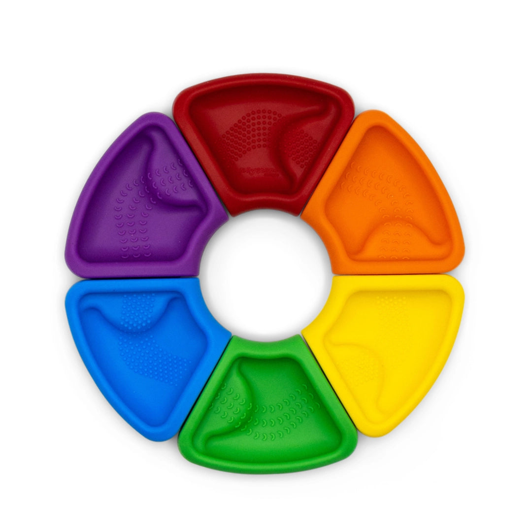 Colorful circular puzzle with six chewable segments designed to help babies recognize colors and develop problem-solving skills