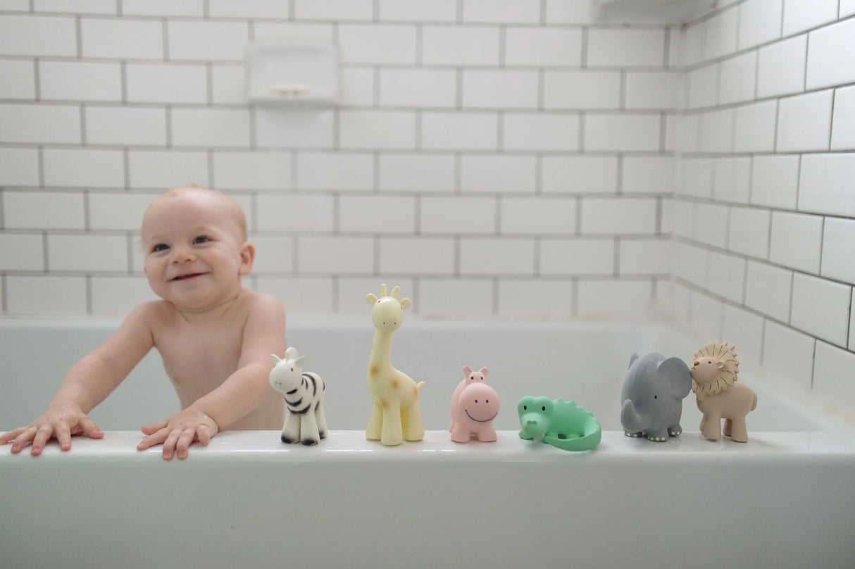 Organic Rubber Teether Rattle | Elephant with baby in bathtub and animal figures lined up on tub edge.