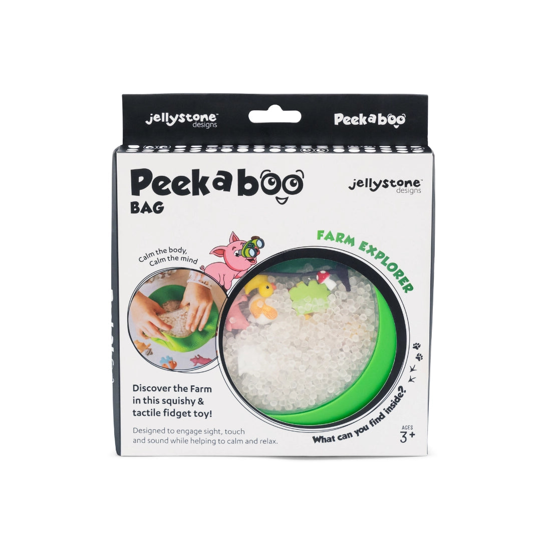 Square package of a green round sensory toy filled with white beads and small colorful farm animal figures inside