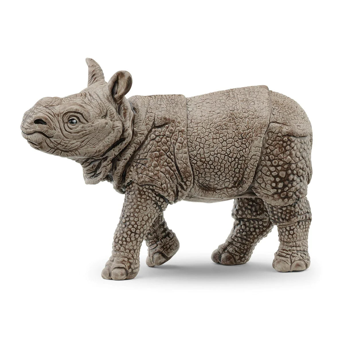 Indian Rhinoceros Baby figurine showing detailed thick, scaly skin and youthful features without a horn.