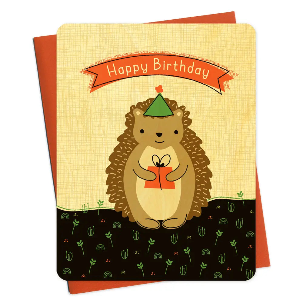 Hedgehog Gift Birthday Wood Card featuring a cute hedgehog with a party hat holding a gift on a textured birch wood background