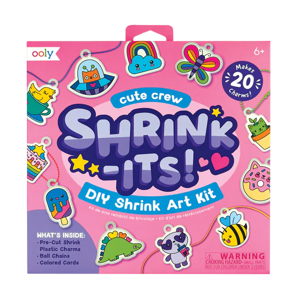 Shrink-Its! Cute Crew DIY Shrink Art Kit with 20 pre-cut charms, ball chains, and colorful cords in a pink box.