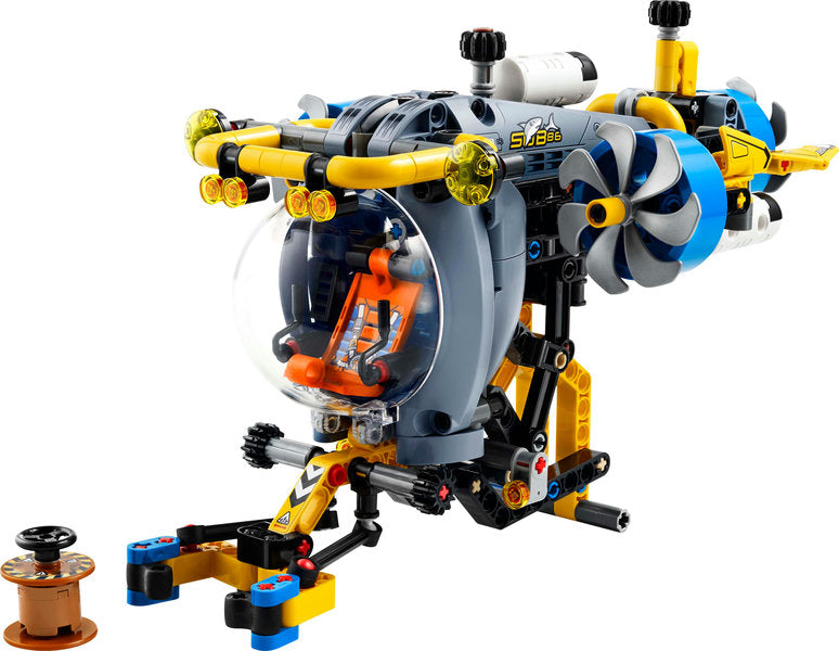 Technic Deep-Sea Research Submarine toy with cockpit, spinning propellers, extending arm, and sea-bed adventure barrel accessory.