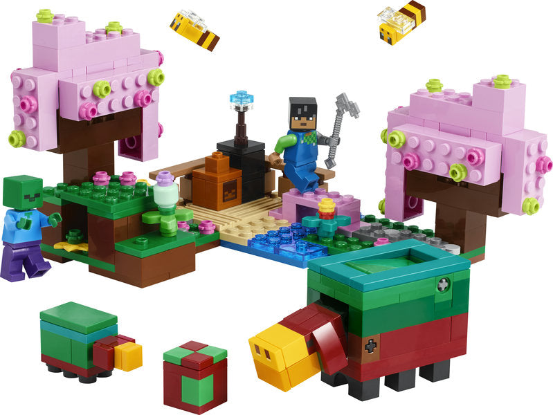 LEGO Minecraft The Cherry Blossom Garden set with pink trees, minifigures, bees, and a colorful parrot build.