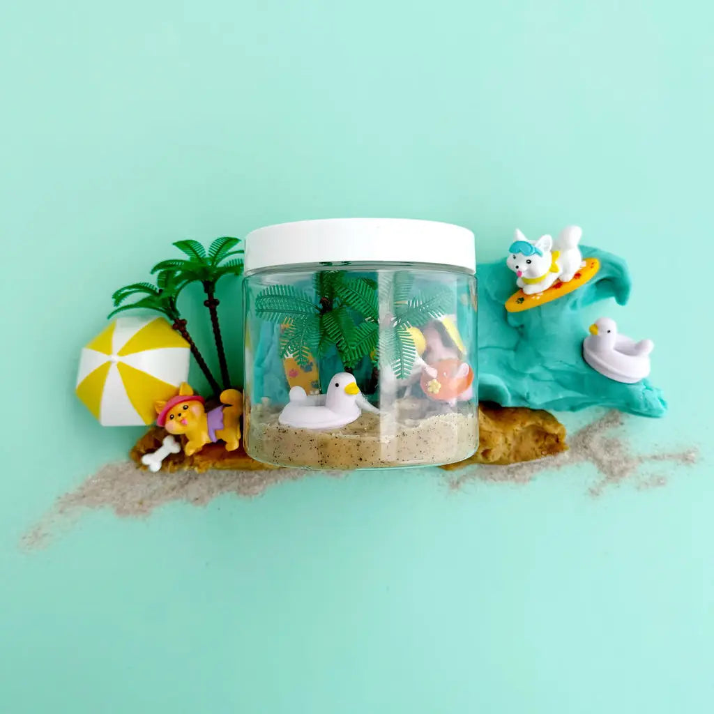 KidDough To Go | Puppy Beach Party with sensory dough, puppy figurines, beach umbrella, palm trees, and ducks in travel container
