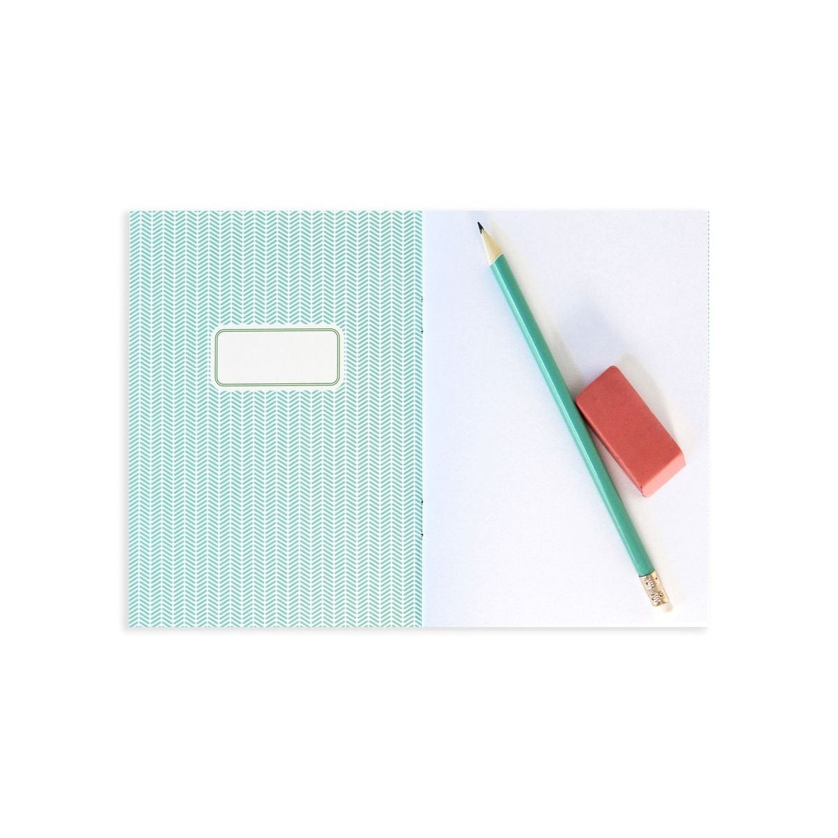 Sketchbook | Grrreat Ideas open showing blank pages with pencil and eraser on white background.