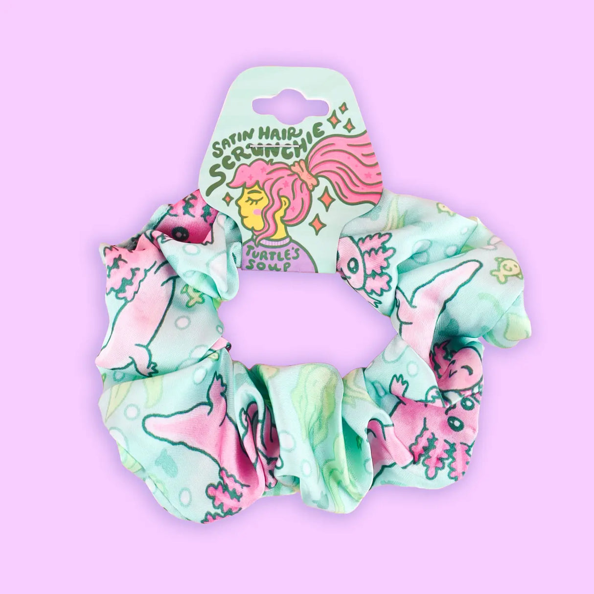 Axolotl Hair Scrunchie made of satin fabric with playful pink and green axolotl pattern, gentle on hair and durable.