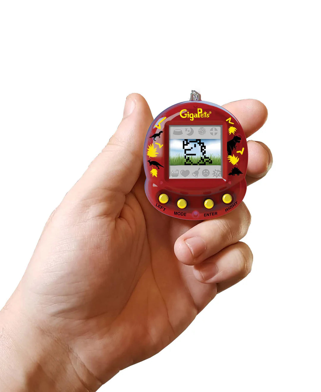 Hand holding the GigaPets Tech T-Rex virtual pet toy with red housing and autumn leaf designs.