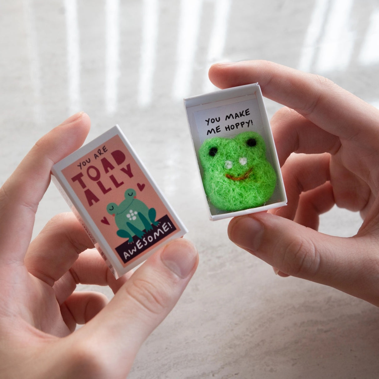 Toadally Awesome Felt Frog Matchbox showing handmade wool felt frog with message "You Make Me Hoppy" in open matchbox.