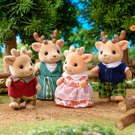 Reindeer Family plush reindeer toys in colorful outfits gathered outdoors