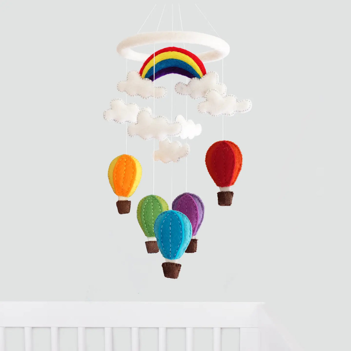 Felt Mobile | Hot Air Balloon with colorful wool hot air balloons, clouds, and a rainbow, perfect nursery decor.