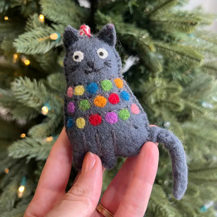 Tangled Up Cat Felt Ornament featuring a gray cat wrapped in colorful lights, handmade from sheep wool for holiday decor.