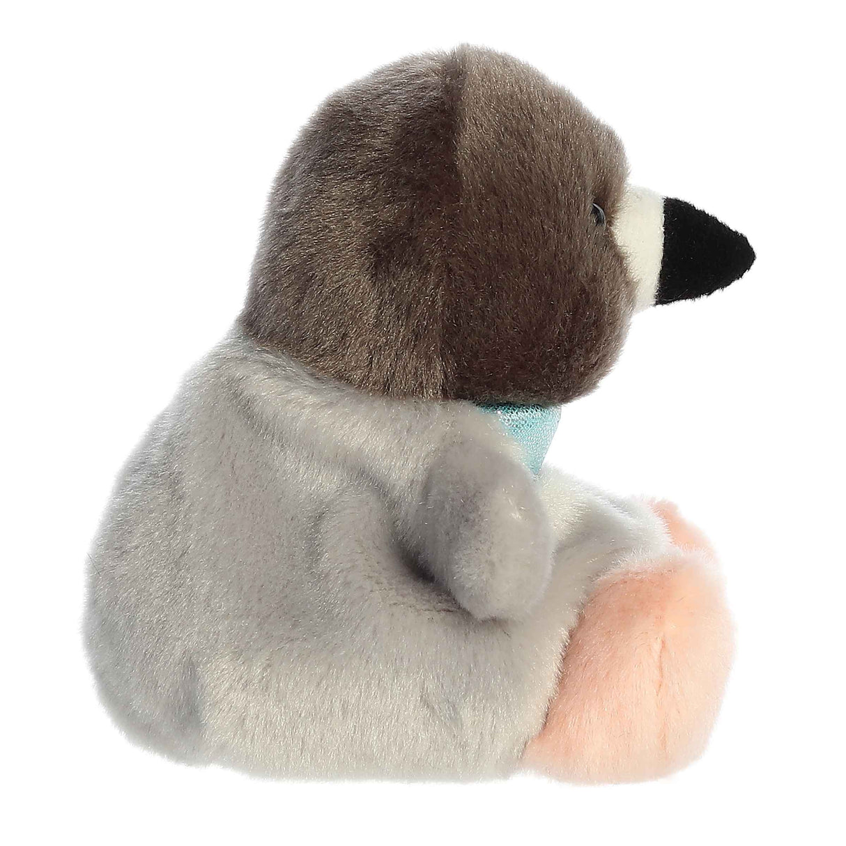 Plush gray and brown pigeon toy with soft pink feet and small blue scarf sits facing right on white background