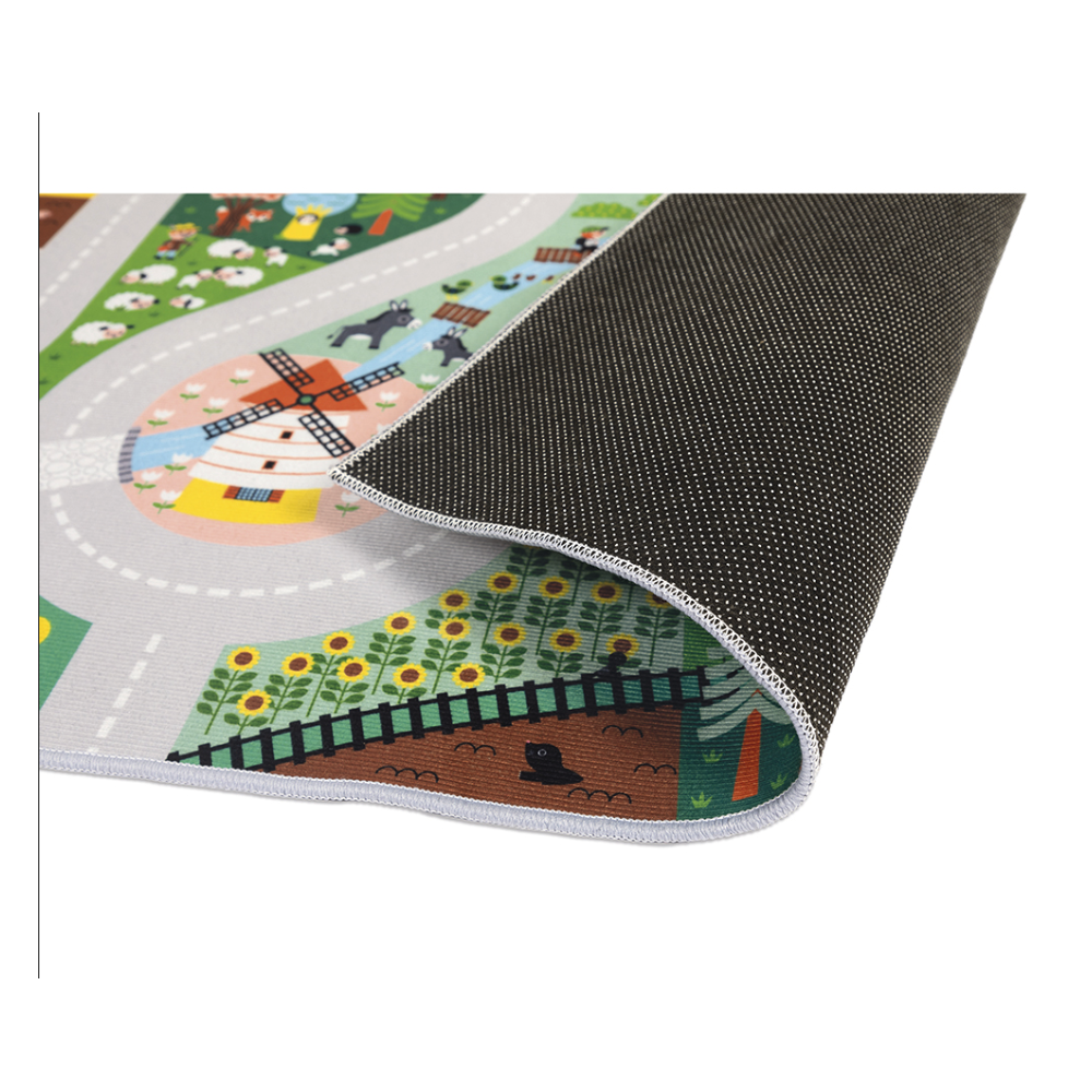 Crossroads Countryside Play Mat showing winding roads, farm scenes, and non-slip backing edge detail for children 2+.