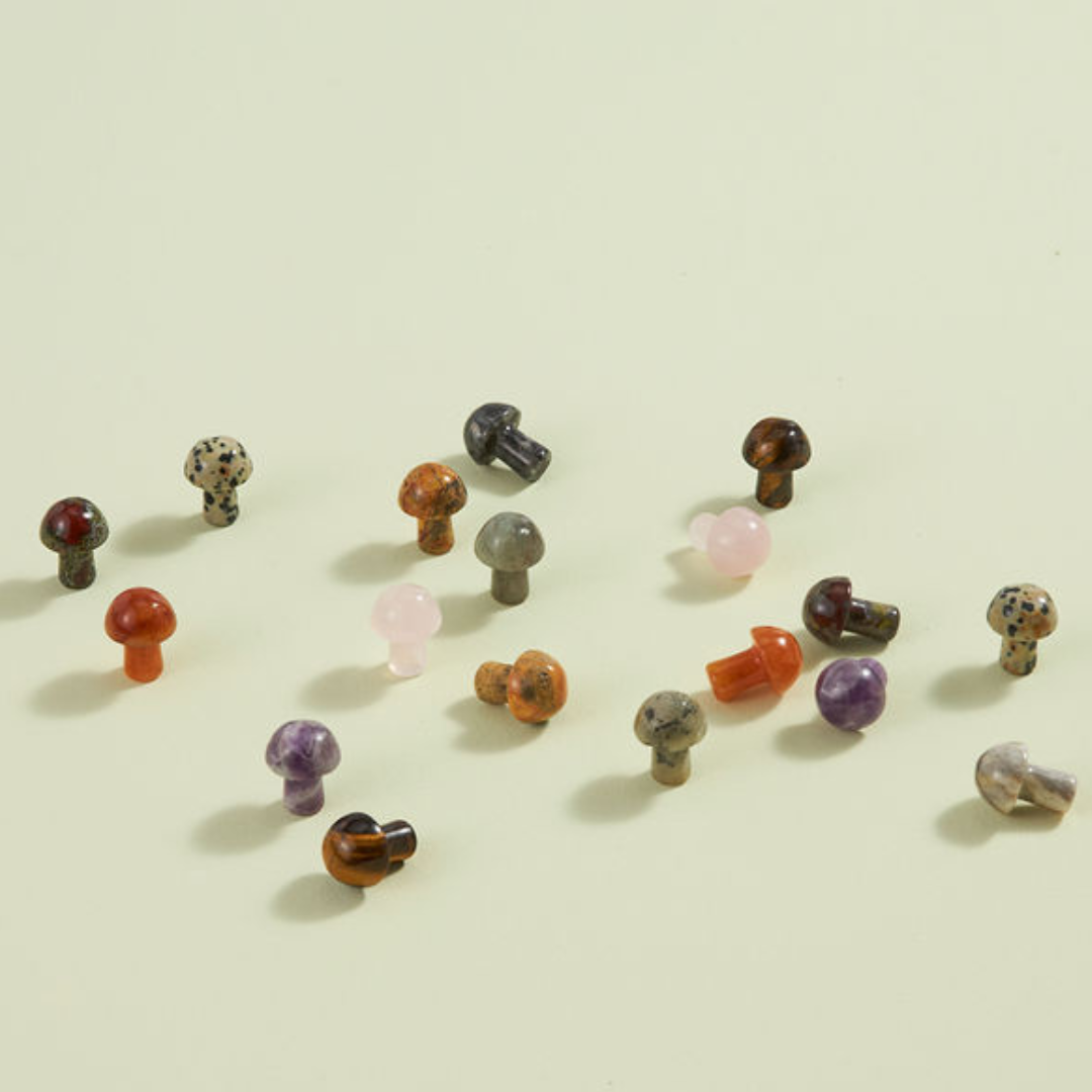 Carved Mushroom mini crystal mushrooms in various stones like rose quartz and tiger eye, playful and colorful decor pieces.