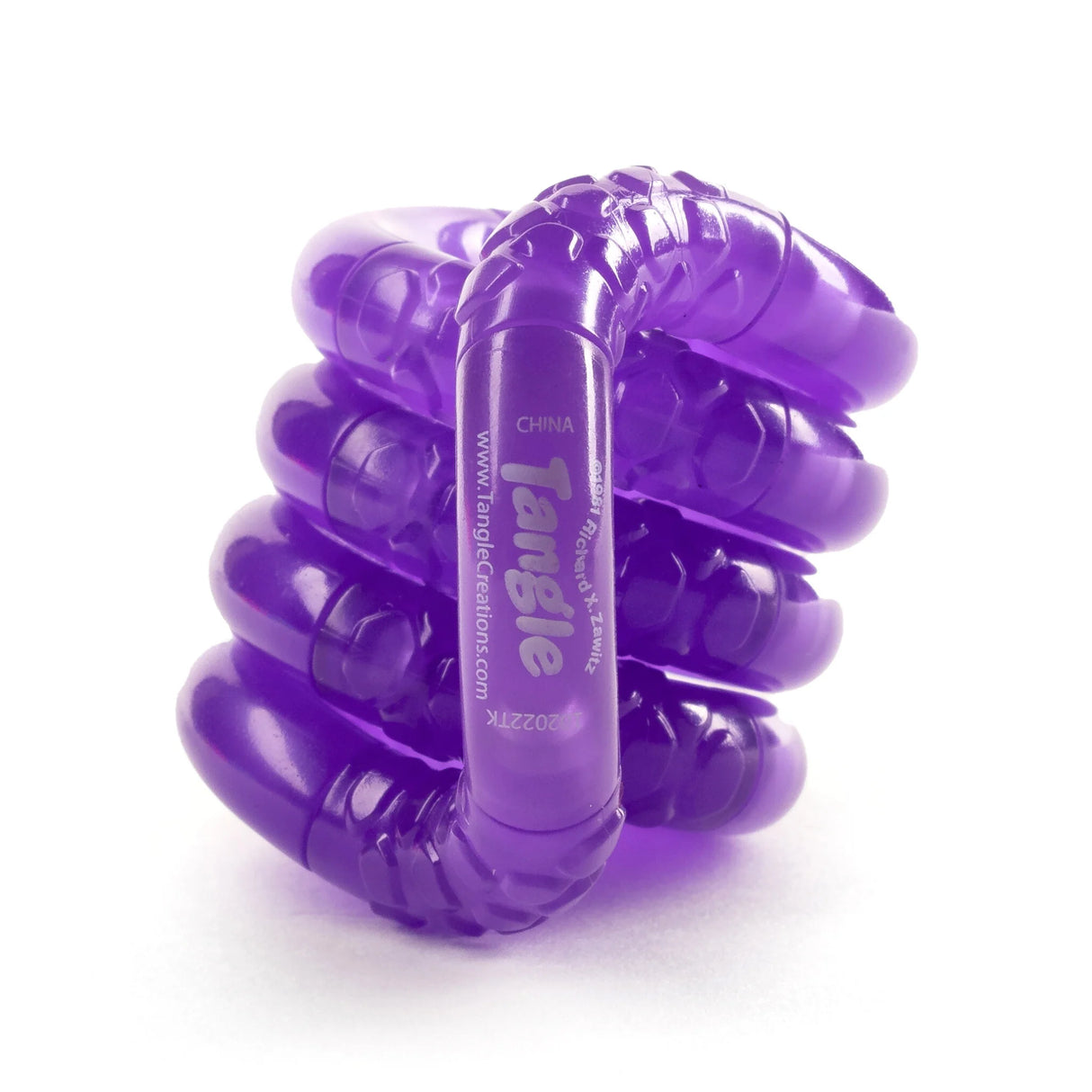 Tangle | Glow in the Dark purple fidget toy coiled showcasing textured phosphorescent plastic sections.