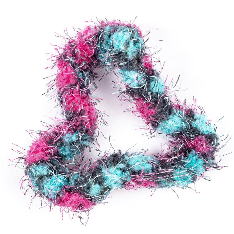 Tangle | Furry sensory toy with soft, bendable, and tactile furry texture in pink, blue, and black colors.