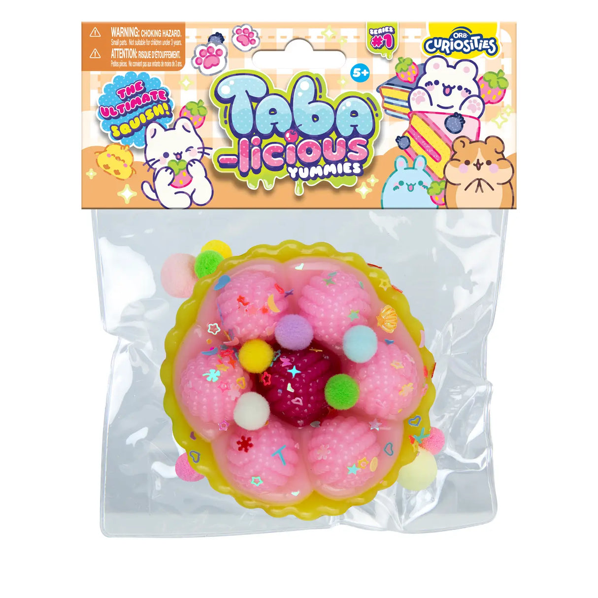 Taba-licious Mega Yummies Squishy pink pastry with colorful pom-poms in clear package for sensory fun and squishy play.
