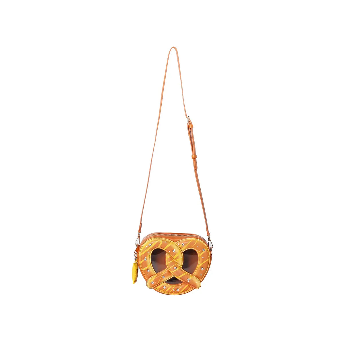 Handbag | Pretzel crossbody bag shaped like a plush pretzel with faux chocolate drizzle and glittery salt accents.