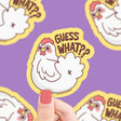 Guess What Chicken Sticker showing a cute white chicken with playful text, printed on durable, waterproof vinyl material.