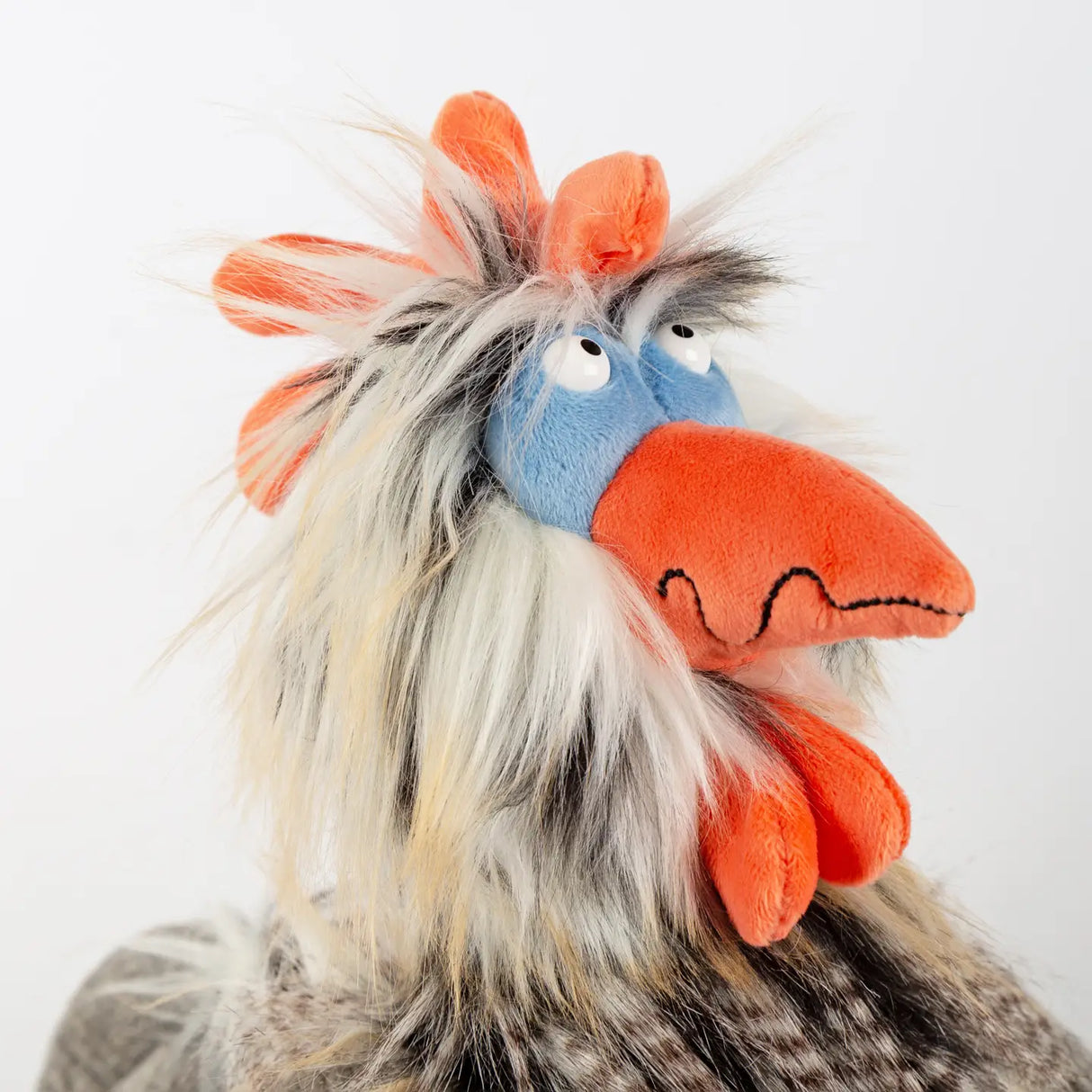 Plush colorful rooster with a quirky squint in "Chicken Tour de Poule" stuffed toy by sigikid KiKeRiKis.
