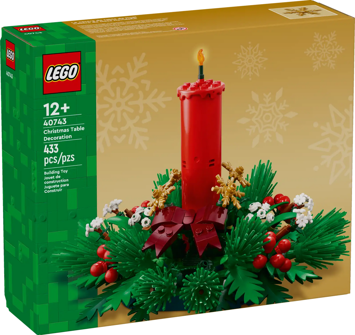LEGO Christmas table decoration featuring a red candle, green foliage, red berries, golden stars, and white flowers