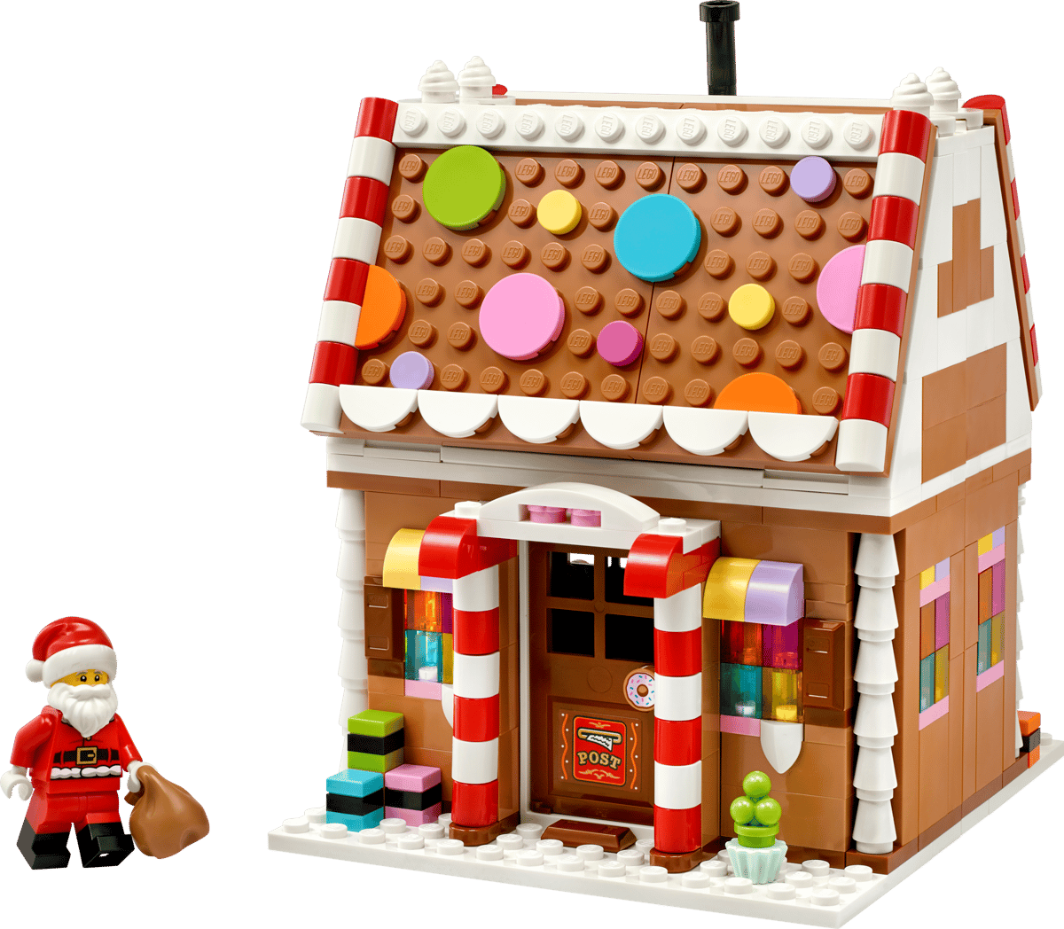 Seasons and Occasions Festive Gingerbread House with colorful candy decorations and Santa figure