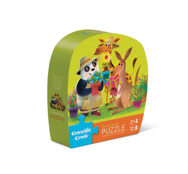 12pc Flower Power Puzzle box showing pandas, giraffes, and kangaroos gardening in a colorful outdoor scene.