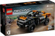 LEGO Technic NEOM McLaren Extreme E Racer model with pull-back action and chunky off-road tires on sandy terrain background