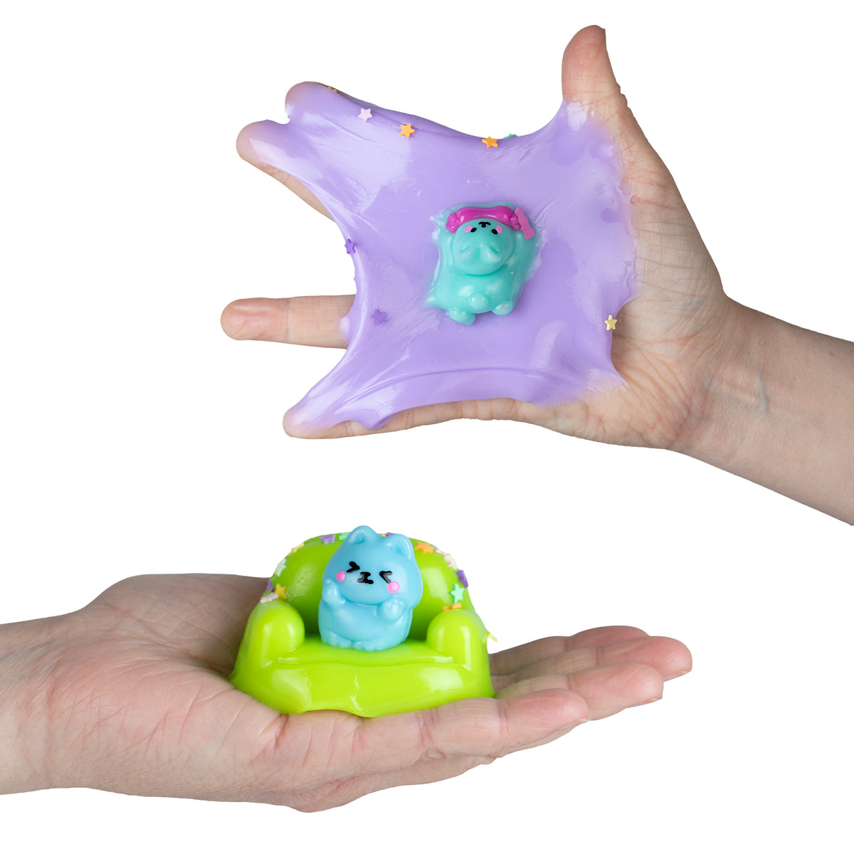 Taba-Licious Couch Potato purple stretchy toy shown in hands with a tiny turquoise figure on a green couch