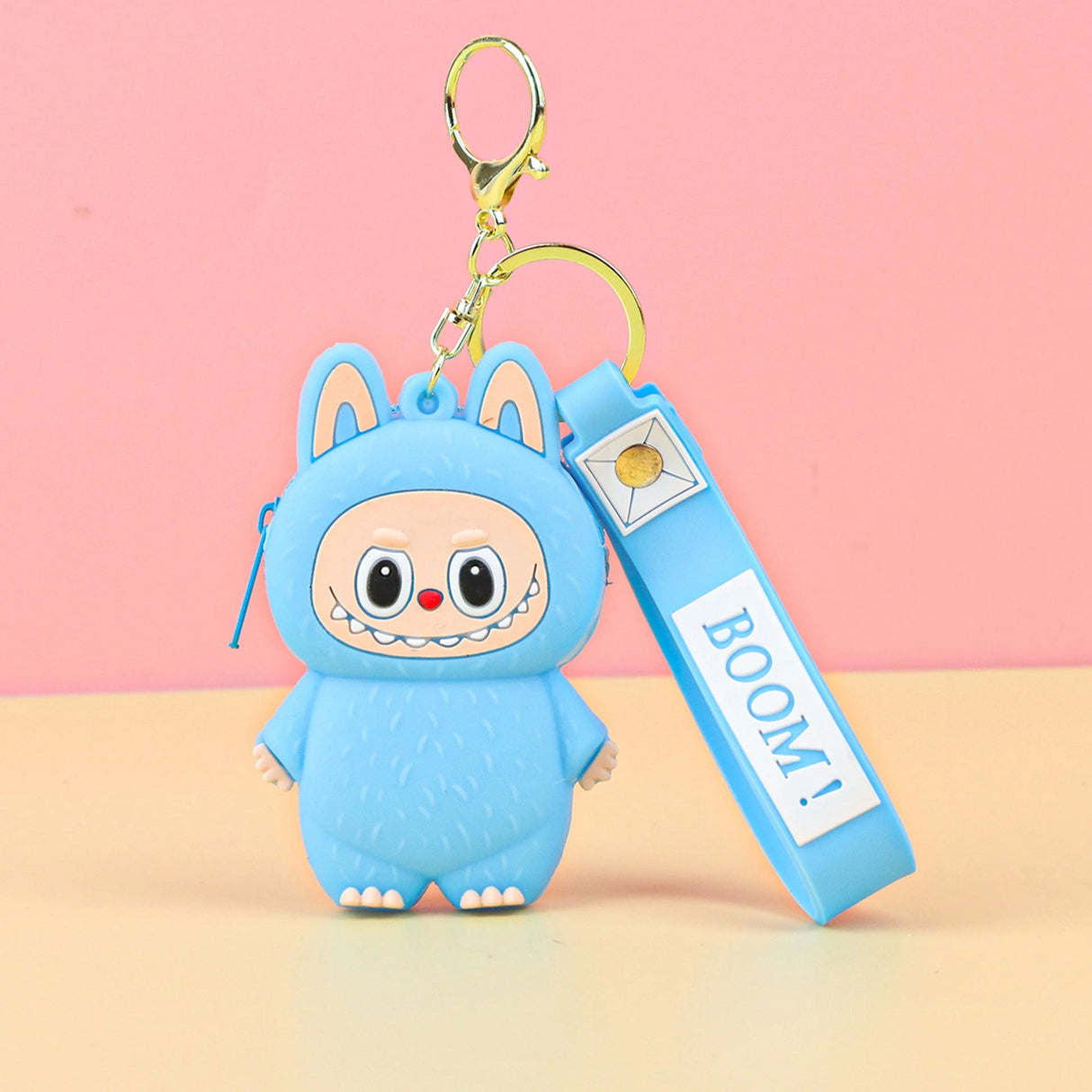 Labubu Cute Coin Purse in blue silicone with a smiling face and keychain, perfect for coins and small items.