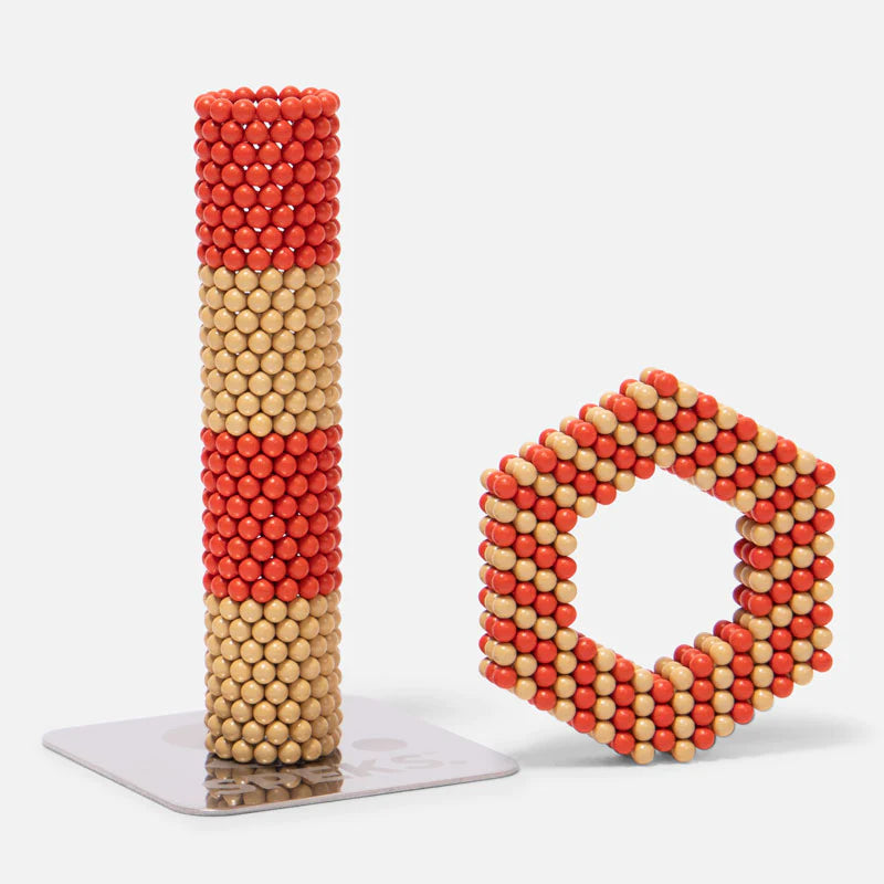 Speks Elements Solar magnetic balls stacked in a tower and shaped into a hexagon for creative desk fun.
