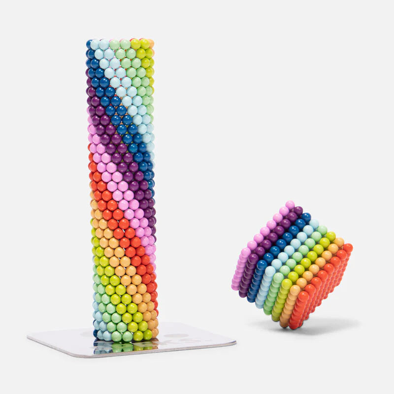 Speks. Matte Spectrum. magnetic balls stacked in a colorful vertical tower and a tilted cube shape on a white background.