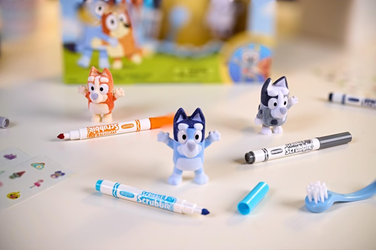 Three Bluey character toys with colorful markers and a scrubbing brush for creative coloring and washing play.