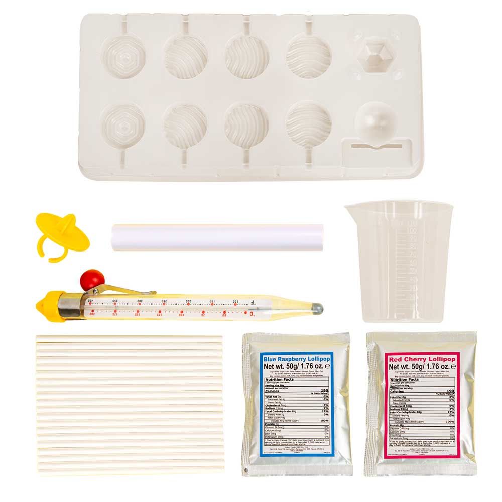 Lollipop Lab kit with lollipop molds, thermometer, measuring cup, sticks, and red cherry and blue raspberry mixes.