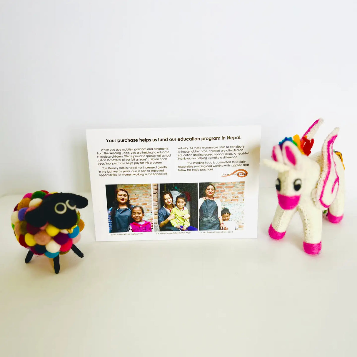 Felt Mobile | Stars and Moon with colorful handmade felt animals showcasing fair trade and natural wool craftsmanship.