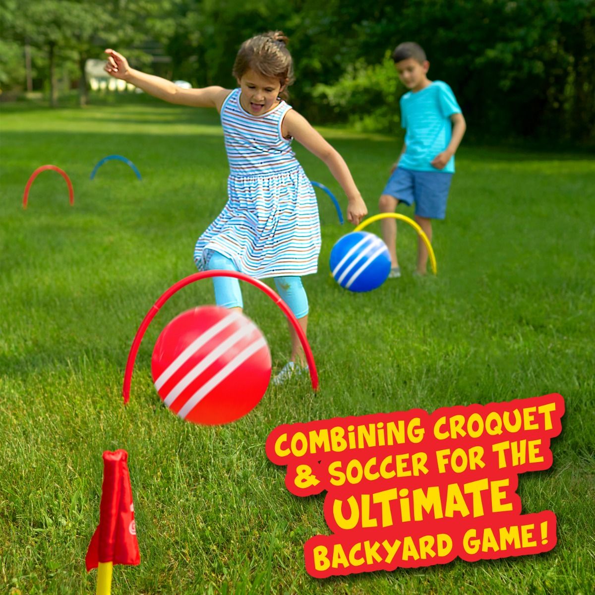 Kids playing Kick Croquet outdoors, kicking striped balls through wickets on a sunny green lawn.