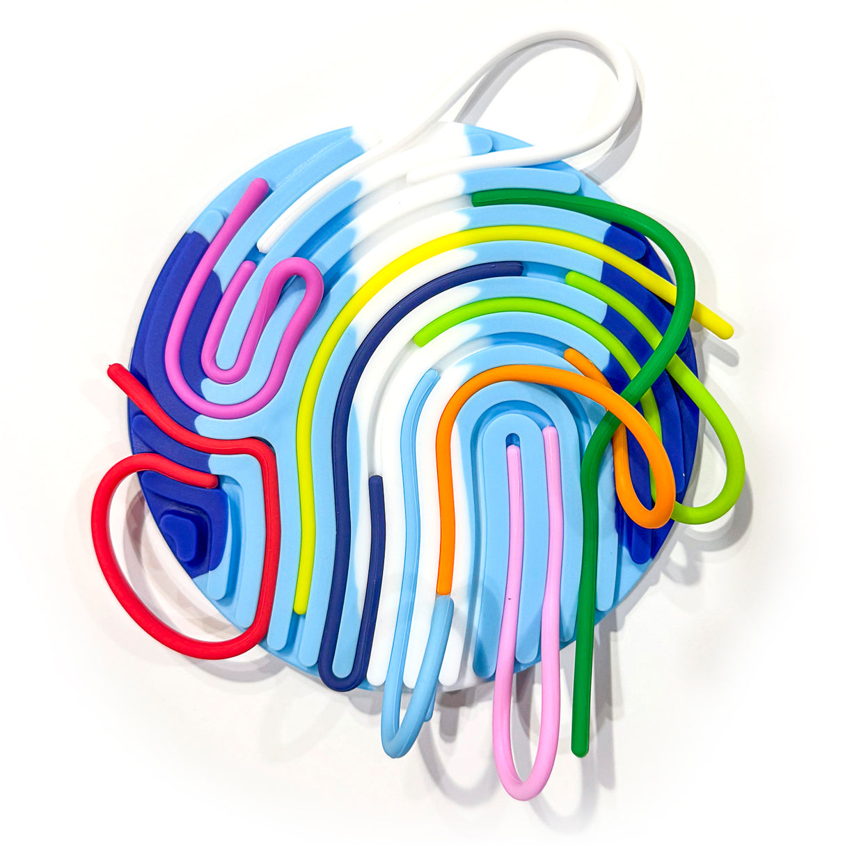 Silly Tubes Silicone Sensory Toy with colorful, flexible silicone strings on a patterned base for calming sensory play.