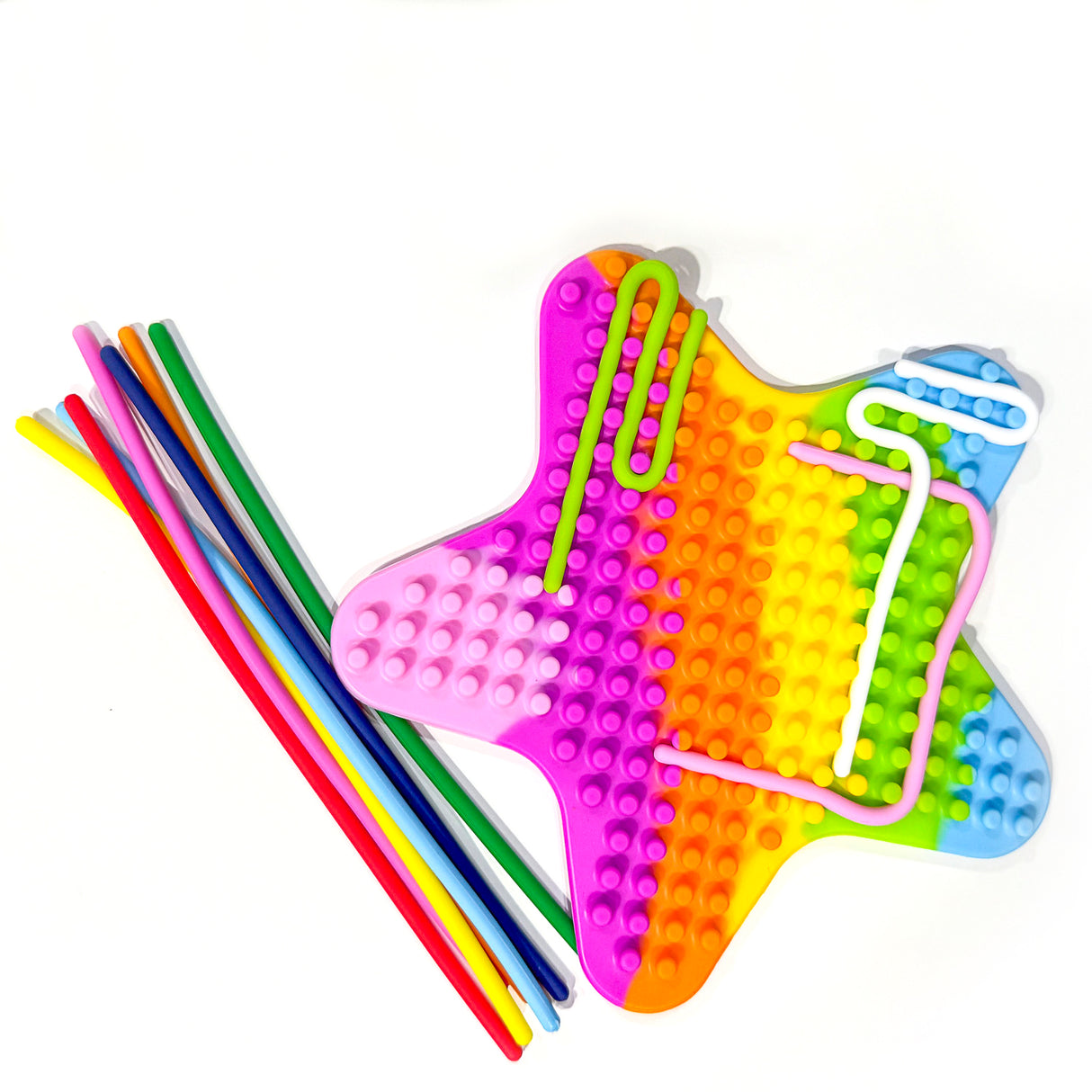 Silly Tubes Silicone Sensory Toy in star shape with colorful strings for push, peel, loop, and bridge sensory play.