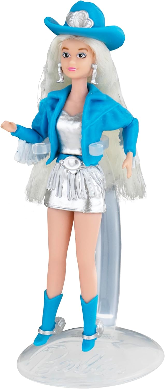 World's Smallest Barbie Cowgirl style wearing blue hat, jacket, silver dress, and boots with long blonde hair.