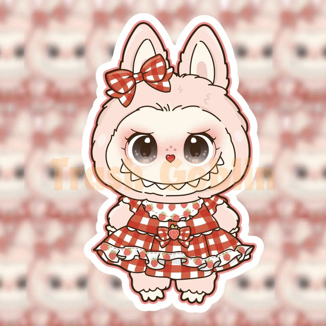 Cute Labubu character sticker wearing a red gingham strawberry dress with a matching bow on the ear.