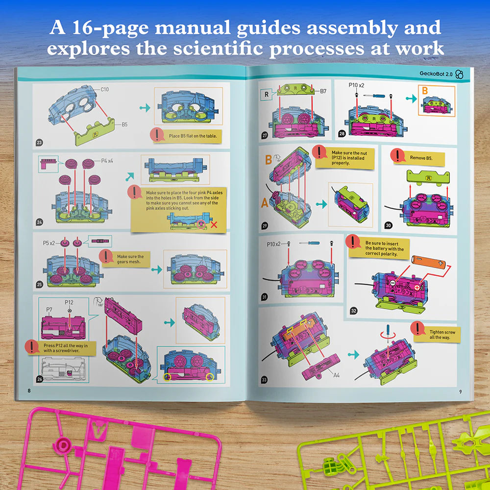 Open instruction manual showing colorful step-by-step assembly diagrams for building a motorized robotic gecko toy