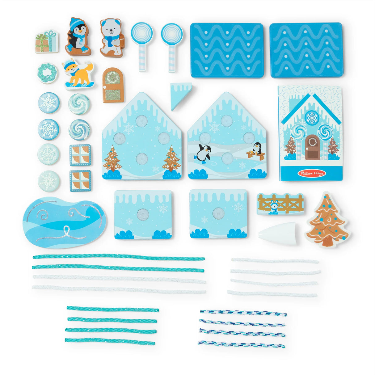 Wooden winter-themed play set with house pieces and reusable blue and white icing cords for festive decoration