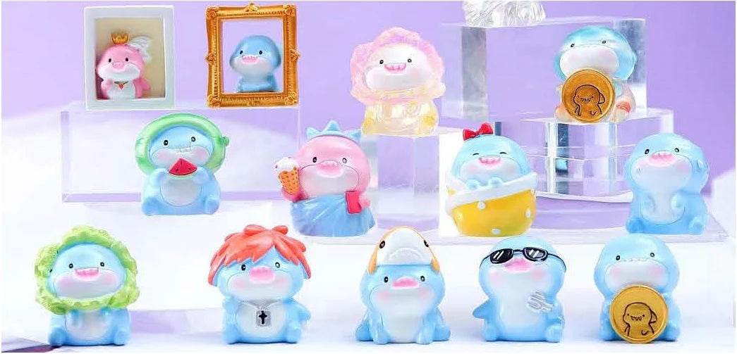 Shark Figurine Blind Box with twelve adorable and colorful resin shark figures displayed on clear stands.