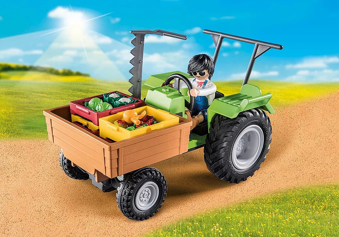 Country | Harvester Tractor w/Trailer with toy farmer transporting fresh vegetables in crates on a sunny farm path.